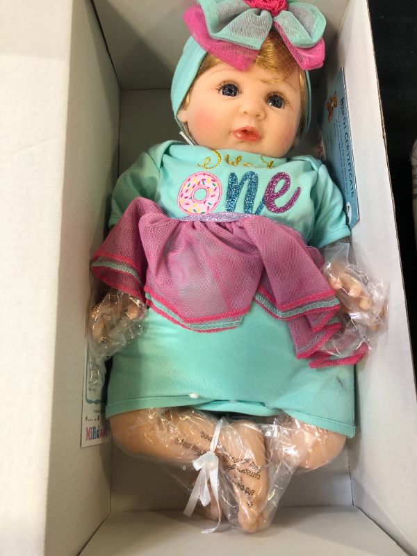 Photo 2 of Milidool Reborn Baby Dolls, Realistic Newborn Baby Girl Doll, 22 inch Lifelike Weighted Doll Girl with Feeding Toy Set