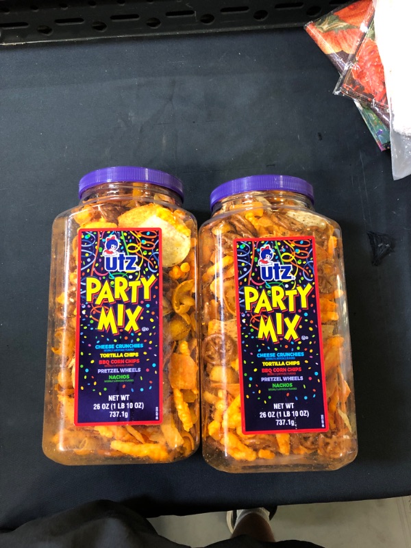 Photo 2 of 2 Pk Utz Party Mix - 26 Ounce Barrel - Tasty Snack Mix Includes Corn Tortillas, Nacho Tortillas, Pretzels, BBQ Corn Chips and Cheese Curls, Easy and Quick Party Snacks, Cholesterol Free and Trans-Fat Free BEST BY 6/27/22
