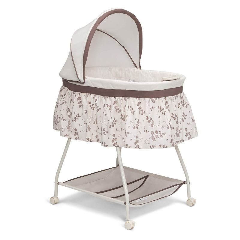 Photo 1 of Delta Children Deluxe Sweet Beginnings Bedside Bassinet - Portable Crib with Lights and Sounds, Falling Leaves
