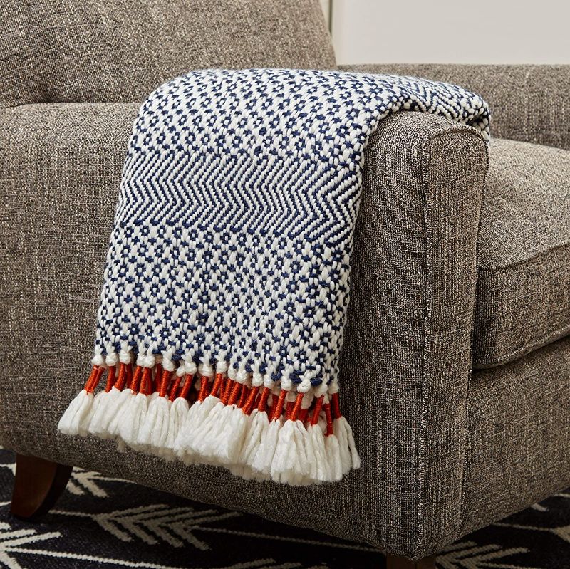 Photo 1 of Amazon Brand – Rivet Modern Hand-Woven Stripe Fringe Throw Blanket, 50" x 60", Navy Blue and White with Sienna Orange
