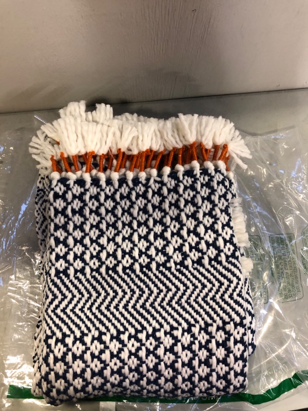 Photo 2 of Amazon Brand – Rivet Modern Hand-Woven Stripe Fringe Throw Blanket, 50" x 60", Navy Blue and White with Sienna Orange
