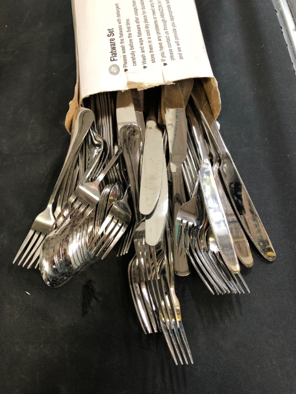 Photo 2 of 50 Piece Silverware Set Service for 10 (ITEM IS USED AND HAS WATER MARKS)