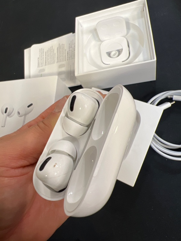 Photo 4 of Apple AirPods Pro Wireless Earbuds with MagSafe Charging Case. Active Noise Cancelling, Transparency Mode, Spatial Audio, Customizable Fit, Sweat and Water Resistant. Bluetooth Headphones for iPhone (ITEM HAS A STAIN ON ONE OF THE EARBUDS)
