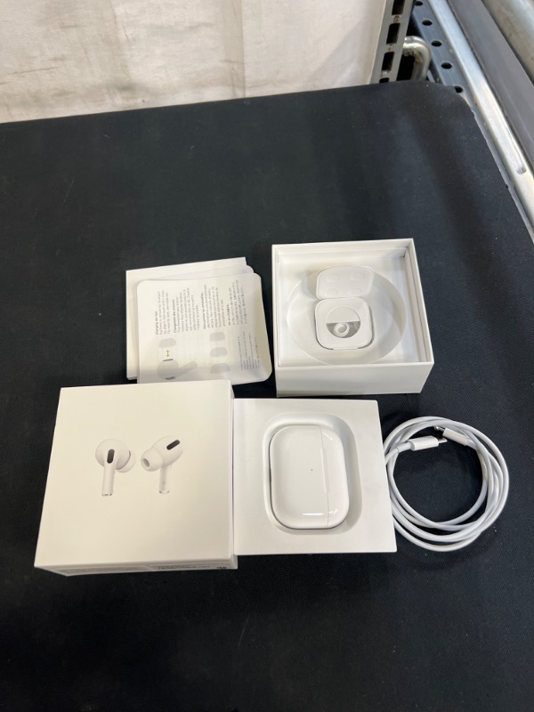 Photo 2 of Apple AirPods Pro Wireless Earbuds with MagSafe Charging Case. Active Noise Cancelling, Transparency Mode, Spatial Audio, Customizable Fit, Sweat and Water Resistant. Bluetooth Headphones for iPhone (ITEM HAS A STAIN ON ONE OF THE EARBUDS)
