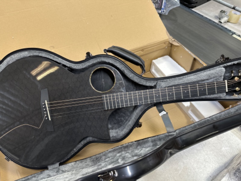 Photo 4 of Enya Carbon Fiber Acoustic Electric Guitar X4 Pro AcousticPlus 41” Cutaway Guitar Bundle with Hard Case, Leather Strap(EA-X4E Pro)
minor damage - small dent on edge