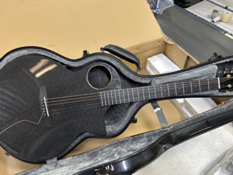 Photo 4 of Enya Carbon Fiber Acoustic Electric Guitar X4 Pro AcousticPlus 41” Cutaway Guitar Bundle with Hard Case, Leather Strap(EA-X4E Pro)
minor damage - small dent on edge, crack in neck