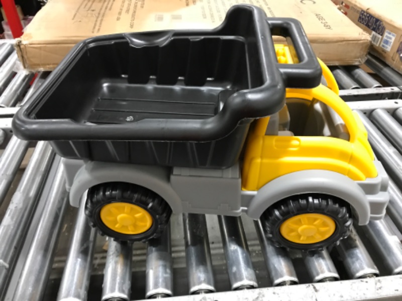 Photo 1 of American Plastic Toys Kids’ Yellow Gigantic Dump Truck, Tilting Dump Bed, Knobby Wheels, and Metal Axles Fit for Indoors and Outdoors, Haul Sand, Dirt, or Toys, for Ages 2 - 14.75 x 24.2” x 14.25”.
