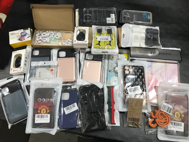 Photo 1 of Lot of phone cases, tablet cases, phone accessories, etc. Sold as is.