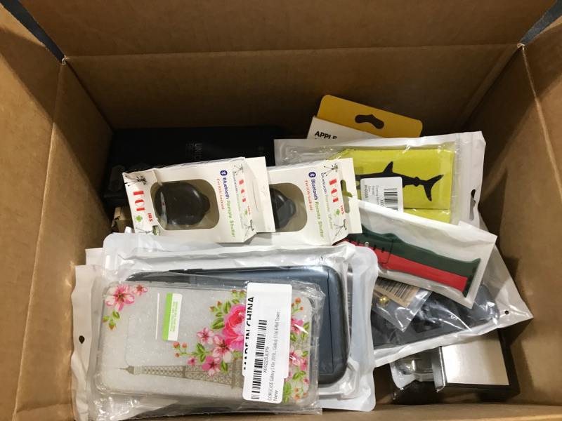 Photo 1 of Lot of phone cases, tablet cases, phone accessories, etc. Sold as is.