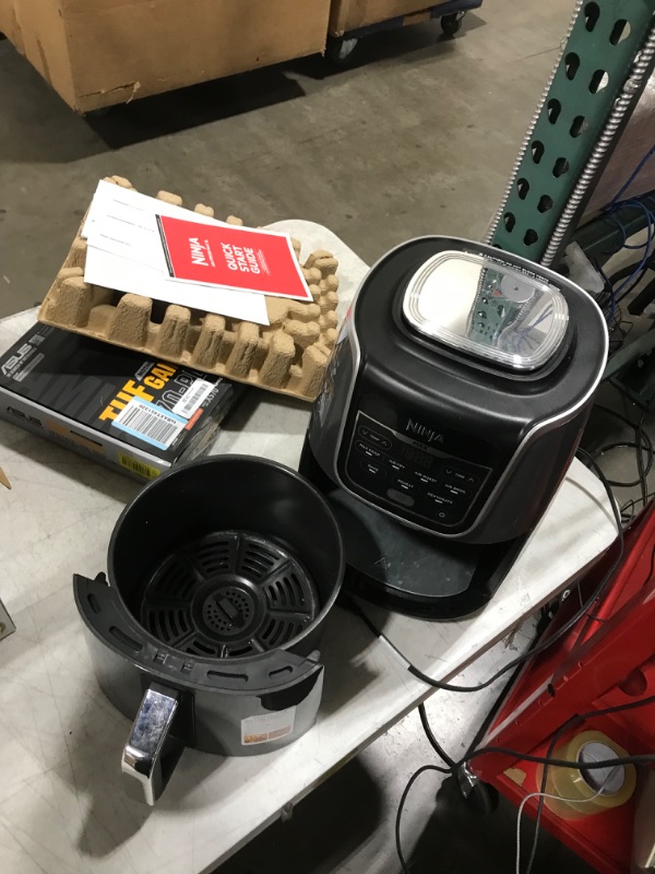 Photo 2 of Ninja AF161 Max XL Air Fryer that Cooks, Crisps, Roasts, Bakes, Reheats and Dehydrates, with 5.5 Quart Capacity, and a High Gloss Finish, Grey
(NEEDS CLEANING)
