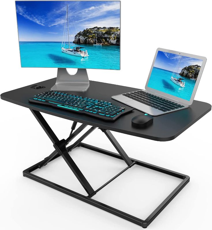 Photo 1 of Standing Desk Converter Adjustable Height Desk Riser, Sit Stand Desk Dual Monitor and Laptop Workstation, Ergonomic Desk Tabletop Computer Workstation Home Office Desk (31in)