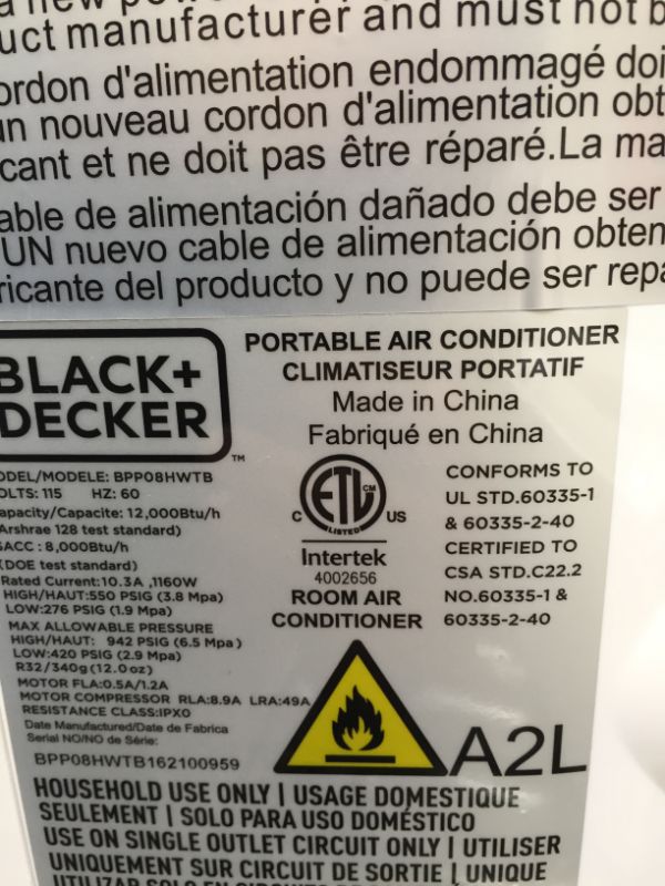 Photo 7 of BLACK+DECKER 12,000 BTU Portable Air Conditioner with Heat and Remote Control, White------missing item like controller and other items 
