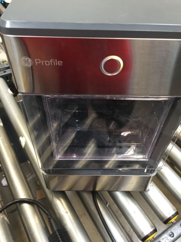 Photo 2 of GE Profile Opal | Countertop Nugget Ice Maker with Side Tank | Portable Ice Machine Makes up to 24 lbs. of Ice Per Day | Stainless Steel Finish----VERY USED ----HAS A DENT ON THE SIDE 
