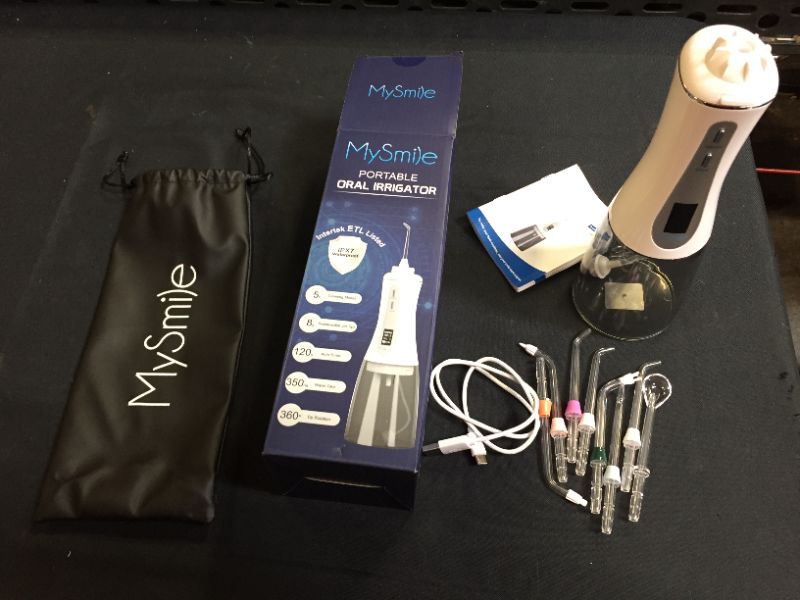Photo 2 of MySmile Powerful Cordless 5 Modes Water Dental Flosser Portable OLED Display Oral Irrigator with 8 Replaceable Jet Tips and 350 ML Detachable Water Tank for Home Travel Use (White) (ITEMS IS USED)
