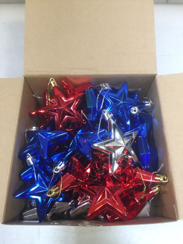 Photo 2 of 48 Pieces 4th of July Patriotic Star Ornaments Independence Day Tree Red Blue Silver Star Ornaments for Home Party Indoor Outdoor Star Hanging Decoration Christmas Tree Decor
