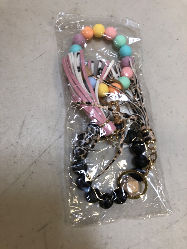 Photo 1 of 2  Pack Keychain Bracelet Silicone Wristlet Stretchy, Key Ring Bracelets with Leather Tassel for Women, Cute Women Beaded Bangle Keychain Wristlet Leather Tassel