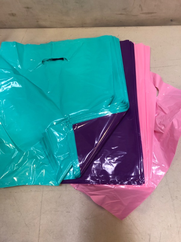 Photo 2 of 150 Pcs Glossy Merchandise Bags, 1.5 Mil Pink Blue Purple Plastic Retail Shopping Bags withe Die Cut Handle for Business, Boutique, Gifts and Tradeshows (12X15 Inch)
