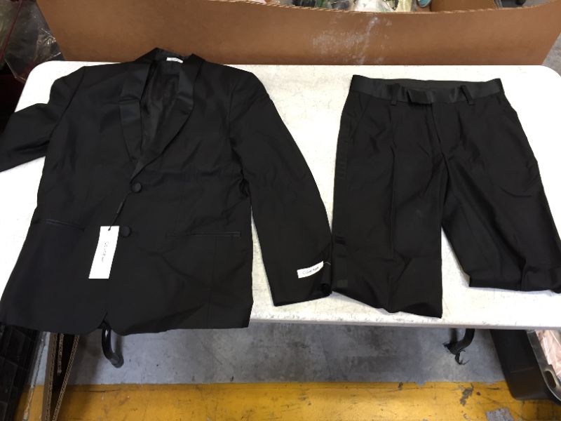 Photo 2 of Calvin Klein Boys' 2-Piece Formal Tuxedo Suit Set, Includes Jacket & Dress Pants, Satin Trim Detailing & Functional Pockets
size 12