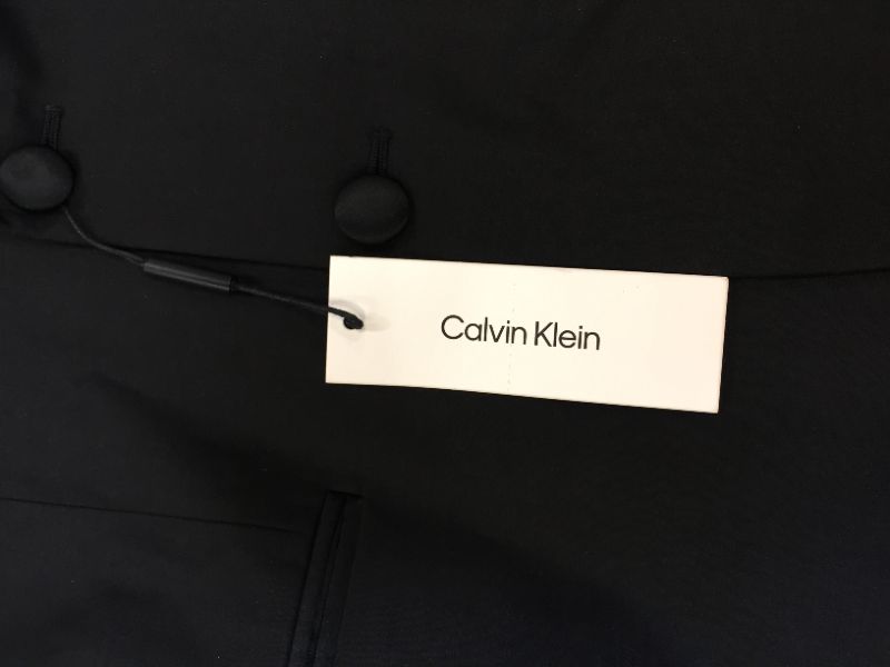 Photo 5 of Calvin Klein Boys' 2-Piece Formal Tuxedo Suit Set, Includes Jacket & Dress Pants, Satin Trim Detailing & Functional Pockets
size 12