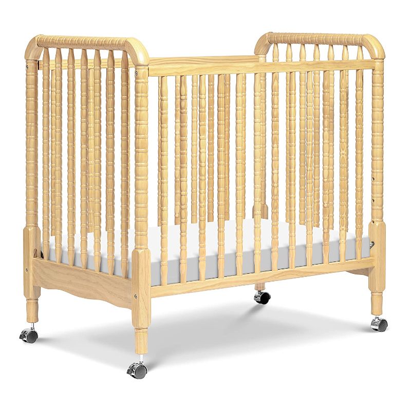 Photo 1 of DaVinci Jenny Lind 3-in-1 Convertible Mini Crib in Natural, Removable Wheels, Greenguard Gold Certified

