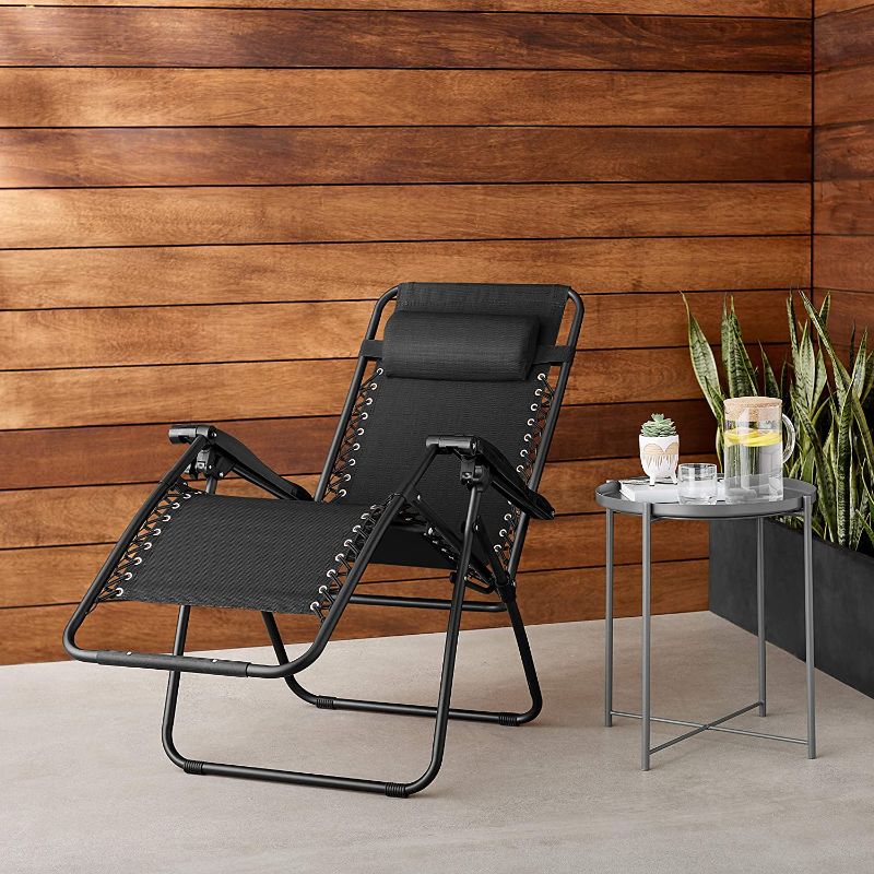 Photo 1 of Amazon Basics Outdoor Textilene Adjustable Zero Gravity Folding Reclining Lounge Chair with Pillow, Black