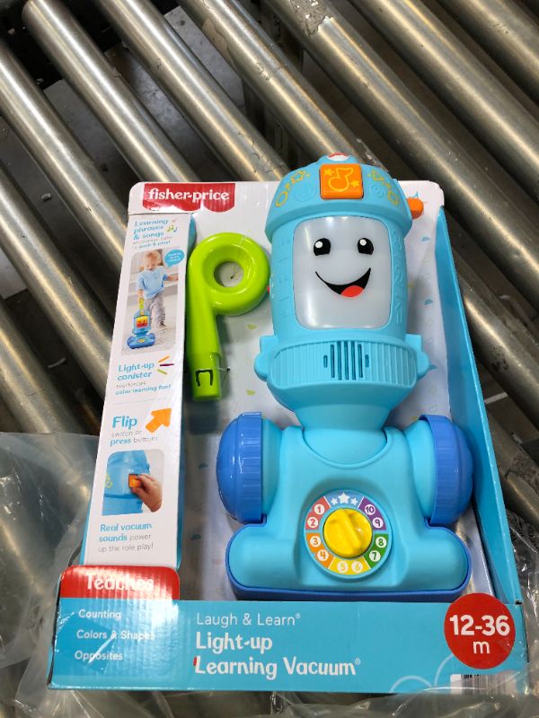 Photo 3 of Fisher-Price Laugh & Learn Toddler Toy Vacuum, Push Toy with Lights Music and Educational Songs, Light-Up Learning
