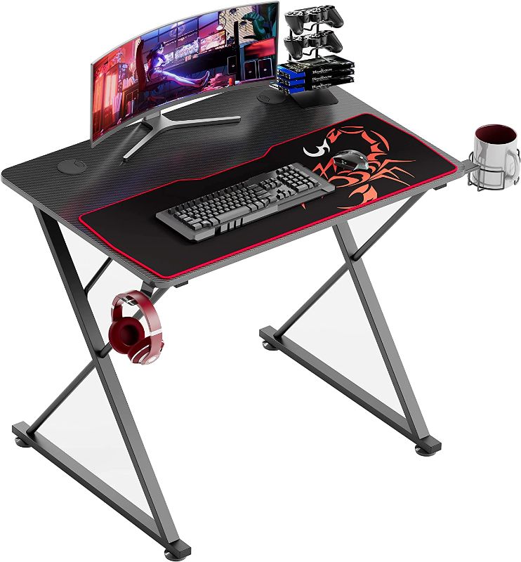 Photo 1 of EUREKA ERGONOMIC Gaming Desk 31 Inch,Small Gaming Table for Kids, X Shaped Computer Desk with Mouse Pad, Carbon Fiber Home Office Desk with Cup Holder & Headphone Hook & Controller Stand,Black
