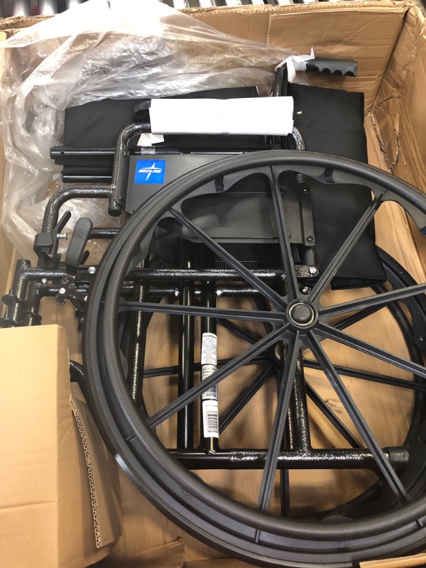 Photo 3 of ****MAJOR DAMAGE TO PACKAGING**** Medline Durable Steel Wheelchair with Flip-Back Desk-Length Arms, Swing Away Footrests, 18-inch Wide SEAT, 300-Ib Weight Capacity, Black