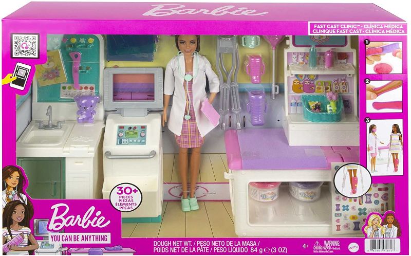 Photo 1 of Barbie Fast Cast Clinic Playset, Brunette Doctor Doll (12-in), 30+ Play Pieces, 4 Play Areas, Cast & Bandage Making, Medical & X-ray Stations, Exam Table