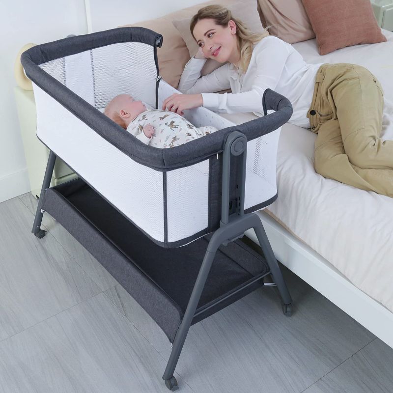 Photo 1 of ANGELBLISS Baby Bassinet Bedside Crib with Storage Basket and Wheels, Easy Folding Bed Side Sleeper Adjustable Height Portable Crib for Newborn 37 x 22 x 32 inches

