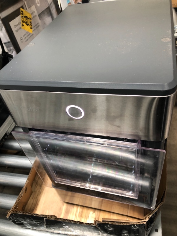 Photo 2 of DAMAGED* TESTED POWERS ON*
GE Profile Opal | Countertop Nugget Ice Maker with Side Tank | Portable Ice Machine Makes up to 24 lbs. of Ice Per Day | Stainless Steel Finish
