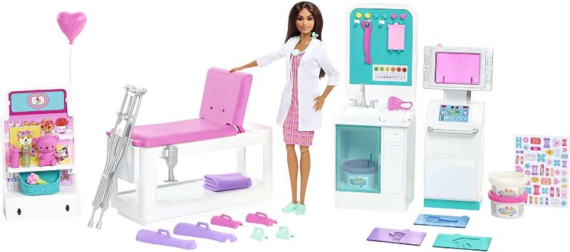 Photo 1 of Barbie Fast Cast Clinic Playset, Brunette Doctor Doll (12-in), 30+ Play Pieces, 4 Play Areas, Cast & Bandage Making, Medical & X-ray Stations, Exam Table, Gift Shop & More, Great Toy Gift
