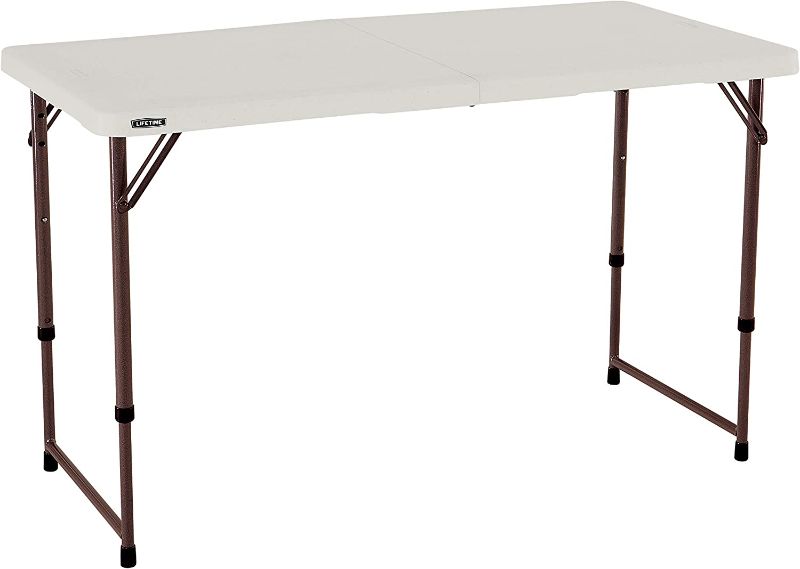 Photo 1 of 4 foot height-adjustable fold in half table