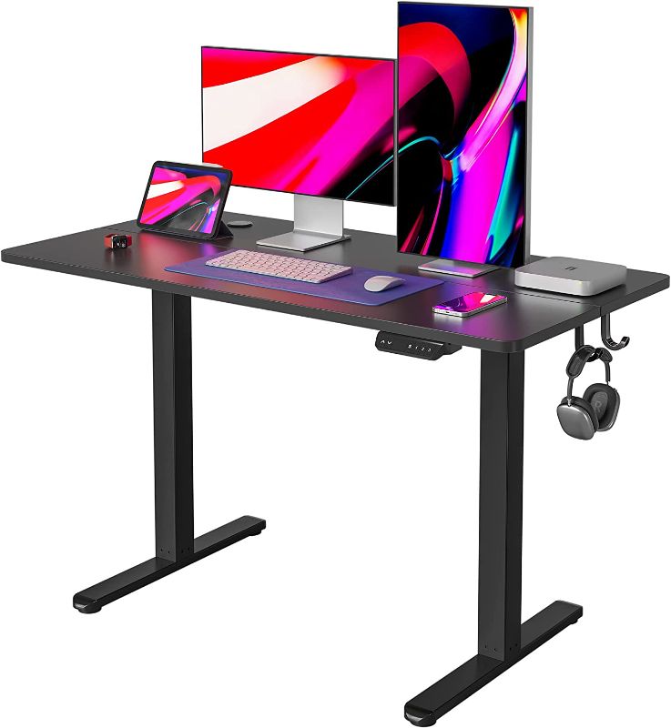 Photo 1 of FEZIBO Height Adjustable Electric Standing Desk, 48 x 24 Inches Stand up Table, Sit Stand Home Office Desk with Splice Board, Black Frame/Black Top
