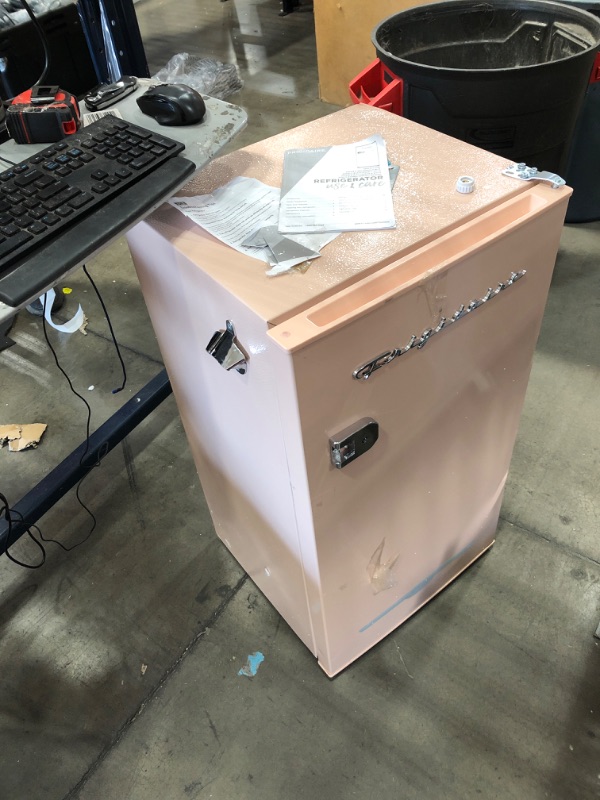 Photo 2 of MISSING DOOR HANDLE***
Frigidaire EFR376-CORAL Retro Bar Fridge Refrigerator with Side Bottle Opener, 3.2 cu. Ft, Coral
