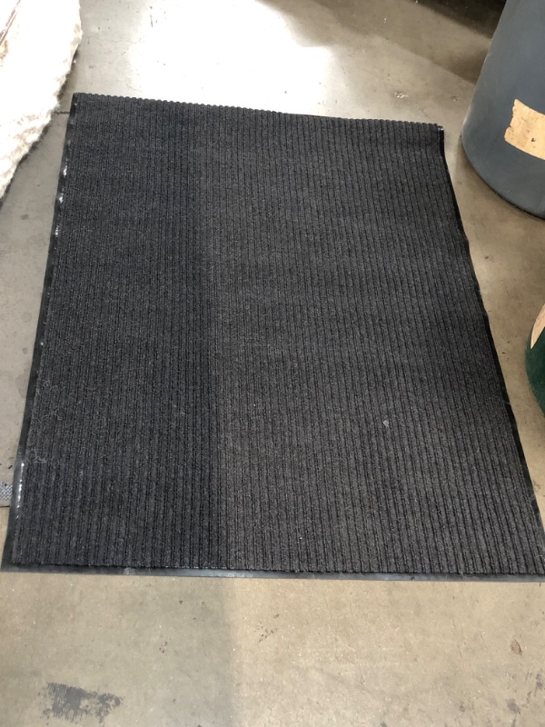Photo 1 of 35"x47 black door mat/rug (Unknown brand/model) 