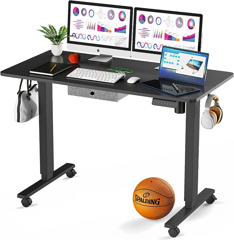 Photo 1 of USED: Zartiland Electric Standing Desk with Wheels & Fabric Drawer, 48 x 24 Inch Height Adjustable Sit Stand Desk with Memory Preset, Mobile Computer Desk for Home Office with Splice Board, Black
 24"D x 48"W x 48"H
