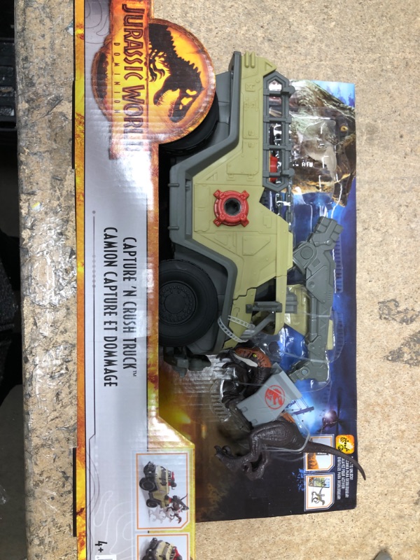 Photo 2 of Jurassic World Dominion Capture and Crush Truck with Velociraptor Dinosaur Figure, Toy Vehicle with Tranquilizer, Crane and 2 Breakaways, Gift with Physical and Digital Play Truck & Velociraptor