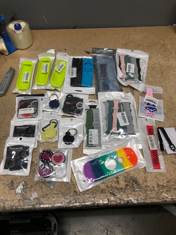 Photo 1 of 17 – miscellaneous things, items are air key rubber tag Apple watch Bands, Roku remote covers and Apple remote covers