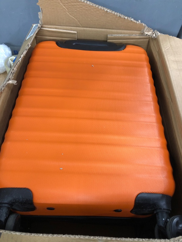 Photo 1 of Amazon Basics 21-Inch Hardside Spinner, Orange Orange 21-inch Spinner