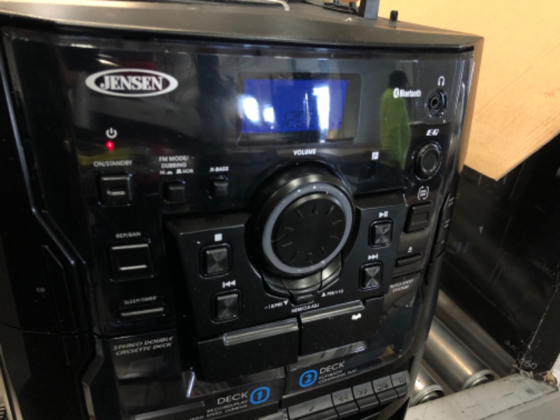 Photo 4 of JENSEN® Bluetooth® 3 Speed Stereo Turntable 3 CD Changer Music System with Dual Cassette Deck, Pitch Control and Remote Control
