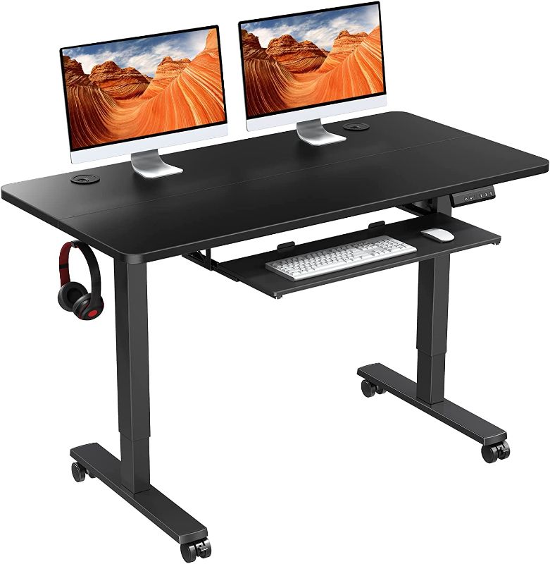 Photo 1 of WOKA Electric Standing Desk Adjustable Height 48x24 in with Memory Controller, Ergonomic Motorized Standing Desk with Keyboard Tray, Rising Desk for Home Office Sit Stand Desk
