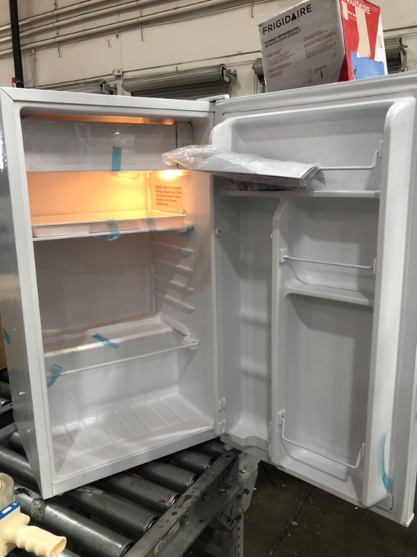 Photo 4 of Frigidaire EFR376-WHITE 3.2 Cu Ft White Retro Bar Fridge with Side Bottle Opener