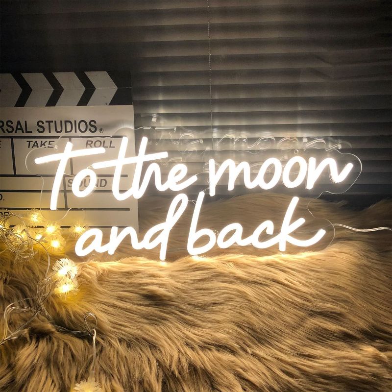 Photo 1 of Neon Sign To The Moon And Back Neon Light Signs for Wedding Decor Home Bedroom Decor Wall Art Neon sign Christmas Club Bar Home Decoration Valentine Xmas New Year Gift for Women Warm White 20x9"
