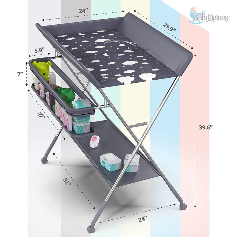 Photo 1 of Babylicious Baby Portable Changing Table - Foldable Changing Table with Wheels - Portable Diaper Changing Station - Adjustable Height Baby Changing Table-Safety Belt and Large Storage Rack for Infants
