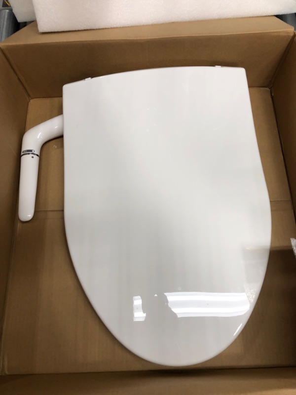 Photo 2 of OPENED TO VERIFY PARTS
Kohler Puretide Elongated Bidet Toilet Seat with Quiet-Close,
