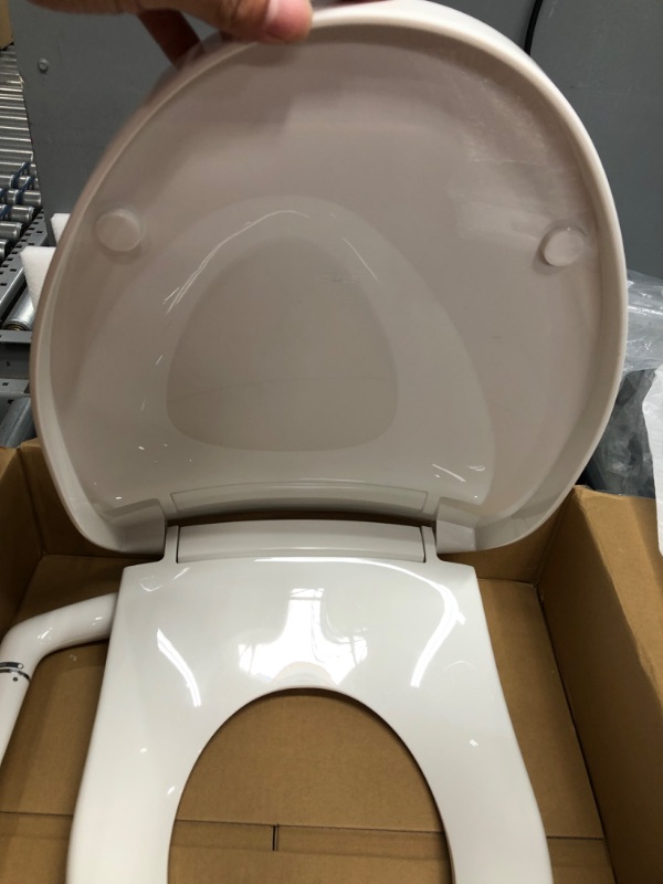 Photo 3 of OPENED TO VERIFY PARTS
Kohler Puretide Elongated Bidet Toilet Seat with Quiet-Close,
