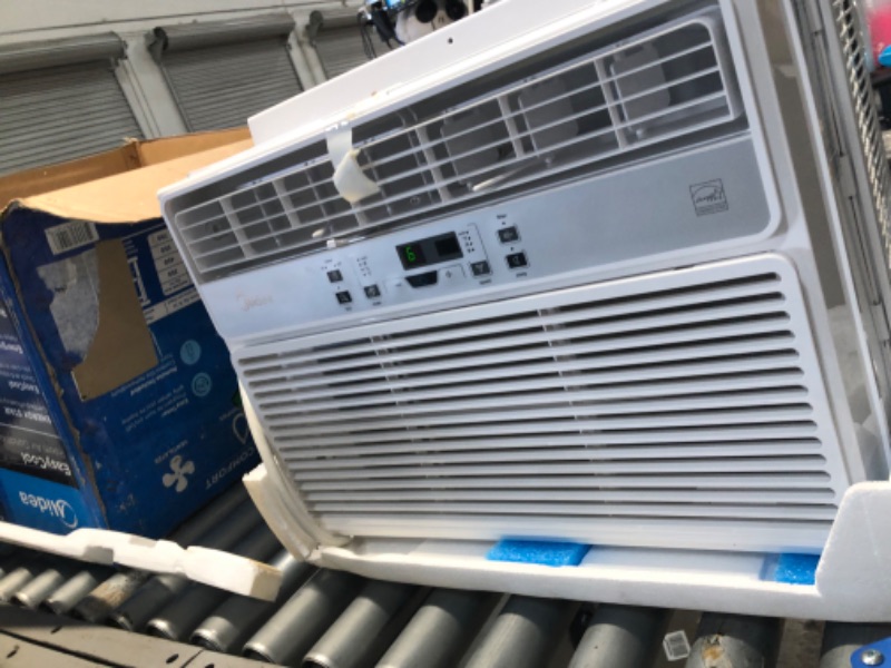 Photo 1 of MIDEA MAW12R1BWT 12,000 BTU EasyCool Window Air Conditioner, Fan-Cools, Circulates, and Dehumidifies Up to 550 Square Feet, Has A Reusable Filter, and Includes an LCD Remote Control
