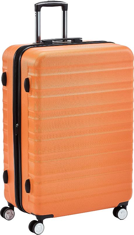 Photo 1 of Amazon Basics Hardside Spinner Suitcase Luggage with Wheels - 28-Inch, Orange
