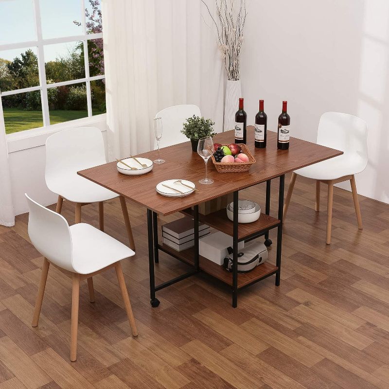 Photo 1 of ***MISSING COMPONENTS*** KOTPOP Folding Dinner Table, Drop Leaf Folding Extension Dinner Table for Kitchen, Farmhouse Room, Space Saving Table with 2 Storage Racks and 2 Wheels, Brown
